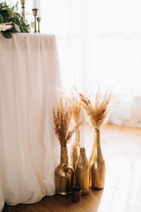 Wedding boho style decor with candles and glass