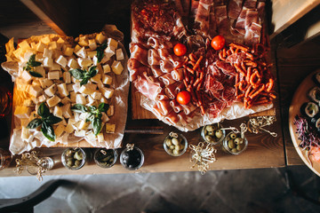 Wedding meat and cheese bar with cheese and tomatoes