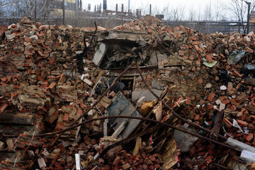 Destroyed old brick industrial building, the ruins of the house.