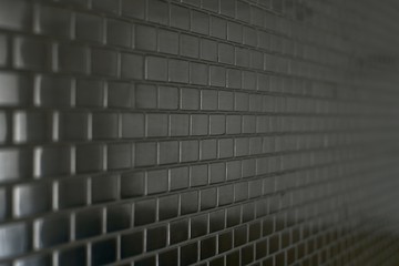 Metal mosaic background with a moving perspective of small bricks.