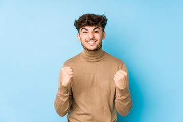 Fototapeta premium Young arabian man isolated cheering carefree and excited. Victory concept.