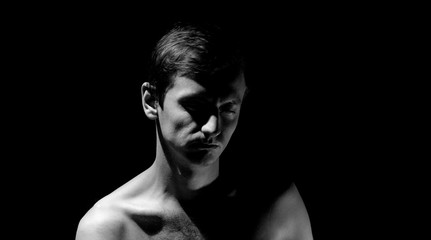 expressive photo, black and white portrait of a guy, with hard light