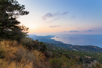 Crete island beach and mountains in sunset time. Greece vacation.