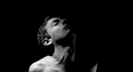 expressive photo, black and white portrait of a guy, with hard light