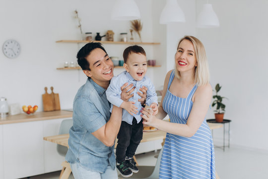 Happy Multicultural Family Having Fun Together In The Kitchen