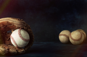 Baseball sport background with copy space, ball in glove close up.