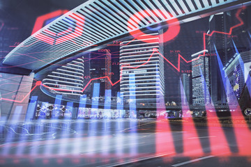 Forex chart on cityscape with tall buildings background multi exposure. Financial research concept.