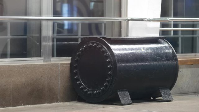 Explosion-proof container stands on subway platform in Moscow, Russia. Part security system of Moscow, St. Petersburg, Nizhny Novgorod and Novosibirsk metro. Cylindrical box made of thick armor steel