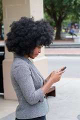 Fototapeta na wymiar Young Woman Using Phone