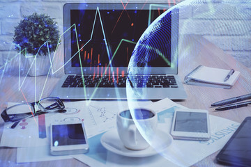 Forex market graph hologram and personal computer on background. Double exposure. Concept of investment.