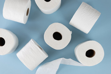 Rolls of toilet paper on blue background