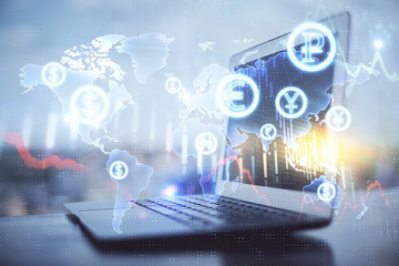 Forex market chart hologram and personal computer background. Double exposure. Concept of investment.