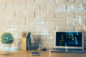 Double exposure of forex chart and work space with computer. Concept of international online...