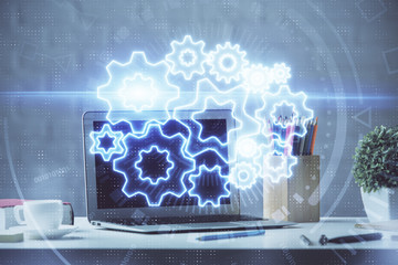 Double exposure of business theme icons and work space with computer background. Concept of success.