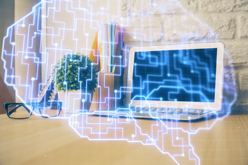 Multi exposure of work space with computer and human brain hologram. Brainstorm concept.