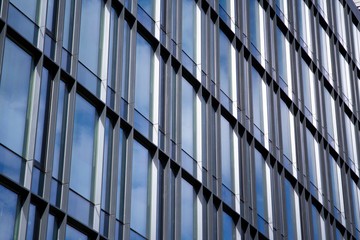 Modern office building facade abstract fragment, shiny windows in steel structure