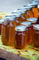 Wild honey in jars for sale  at a farm market