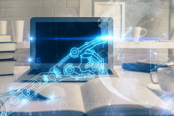 Computer on desktop in office with technology theme hologram. Multi exposure. Tech concept.
