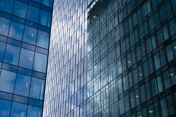Modern office building facade abstract fragment, shiny windows in steel structure