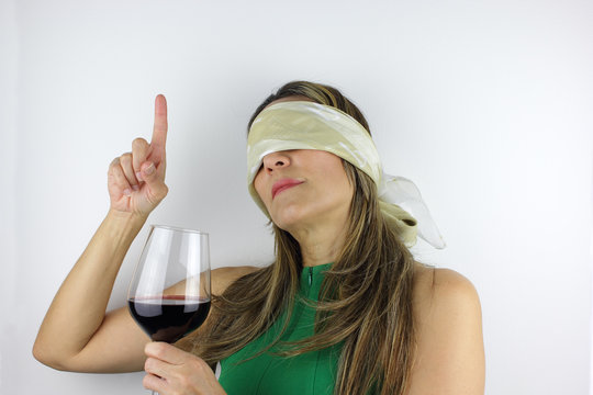 Beautiful Colombian woman guessing and tasting wine