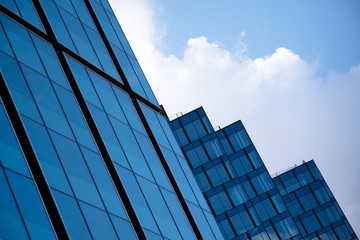 Modern office building facade abstract fragment, shiny windows in steel structure