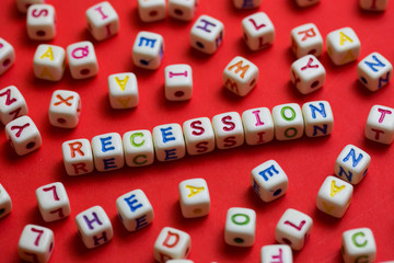 Recession Spelled in Letters on Red Background