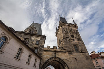 Fototapeta na wymiar Picture of the lesser town bridge tower of Charles Bridge, also called malostranska mostecka vez in Prague, Czech Republic, surrounded by narrow medieval streets and houses