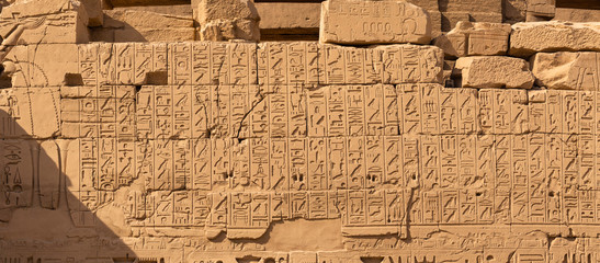 Luxor Governorate, Egypt, Karnak Temple, complex of Amun-Re. Embossed hieroglyphics on columns and...