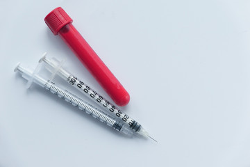Close up Blood Tube and syringe on white background 