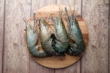 top view of Fresh king prawns on wooden background 