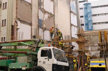 Highrise building construction workers making molds for cement in Casablanca