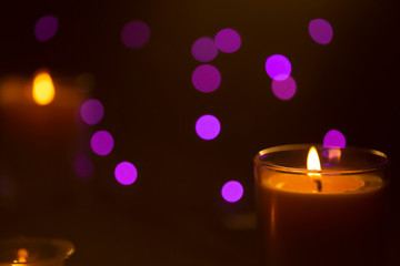 Obraz na płótnie Canvas Burning candle with blurred background