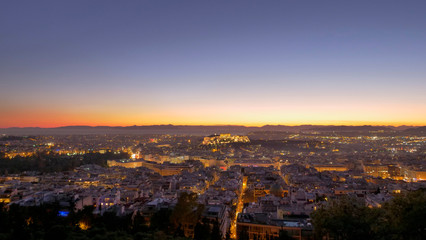 Fototapeta na wymiar Aerial panorama view of night city skyline with orange sky 