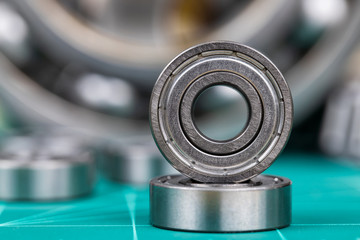 Closeup of steel ball bearings on cutting mate..