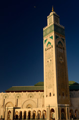 Fototapeta premium Minaret of the Hassan II Mosque in Casablanca Morocco at sunset