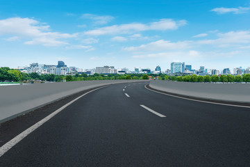 Skyline of Asphalt Pavement and Blue Sky and White Cloud