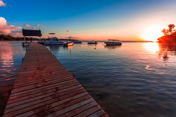 Fototapeta premium old wooden pier at sunset, Balaclava, Mauritius 