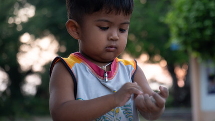 Cute little asian boy play at the park