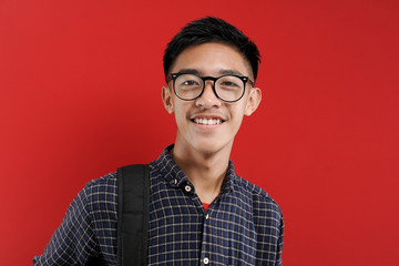Young Asian Student Smiling on camera with eyeglasses