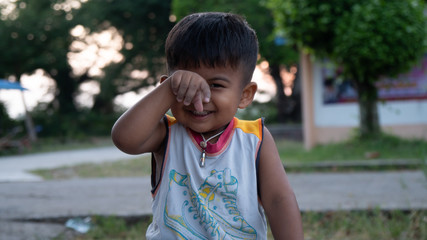 Cute little asian boy play at the park