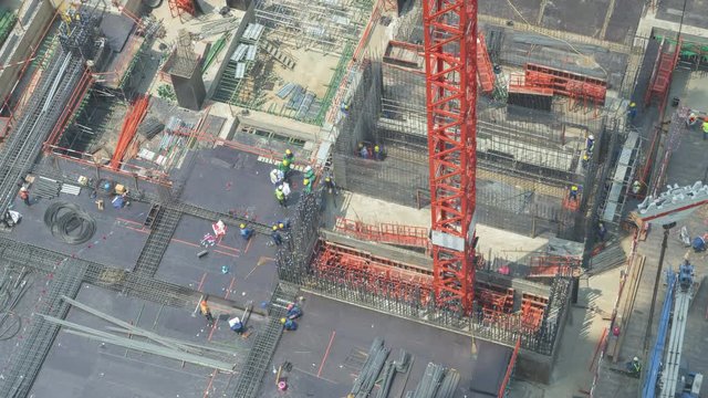 4k uhd timelapse Construction progress of basement high-rise new shopping mall in  Bangkok city aerial timelapse, thailand Cranes and building equipment in financial district near downtown