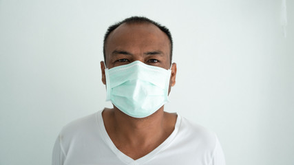 Young man sick and wearing mask on face
