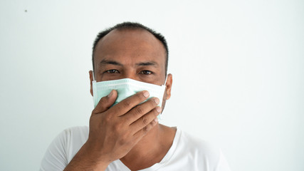 Young man sick and wearing mask on face