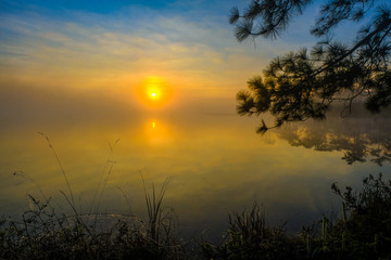 Naklejka na ściany i meble Sunrise at the reservoir on Phu Kradueng, Loei ,Thailand