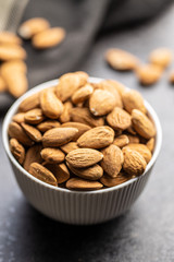 Dried almond nuts in bowl.