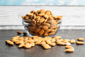 Fototapeta na wymiar Dried almond nuts in bowl.