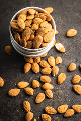 Dried almond nuts in bowl.