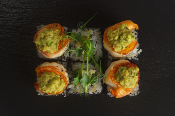 Japanese food: Set of salmon sushi and rolls with salmon and eel
