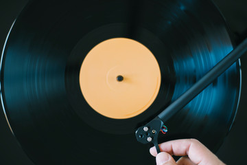 Playing vinyl record. Close up of set up tonearm on record