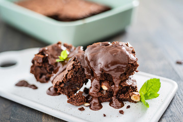 brownie with hazelnuts on the wooden background